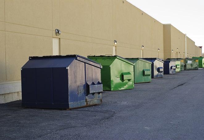 a crowd of dumpsters of all colors and sizes at a construction site in Anderson